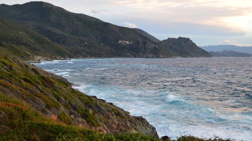 Free Breathtaking coastal view of Ogliastro in Corsica, France during a serene sunset. Stock Photo