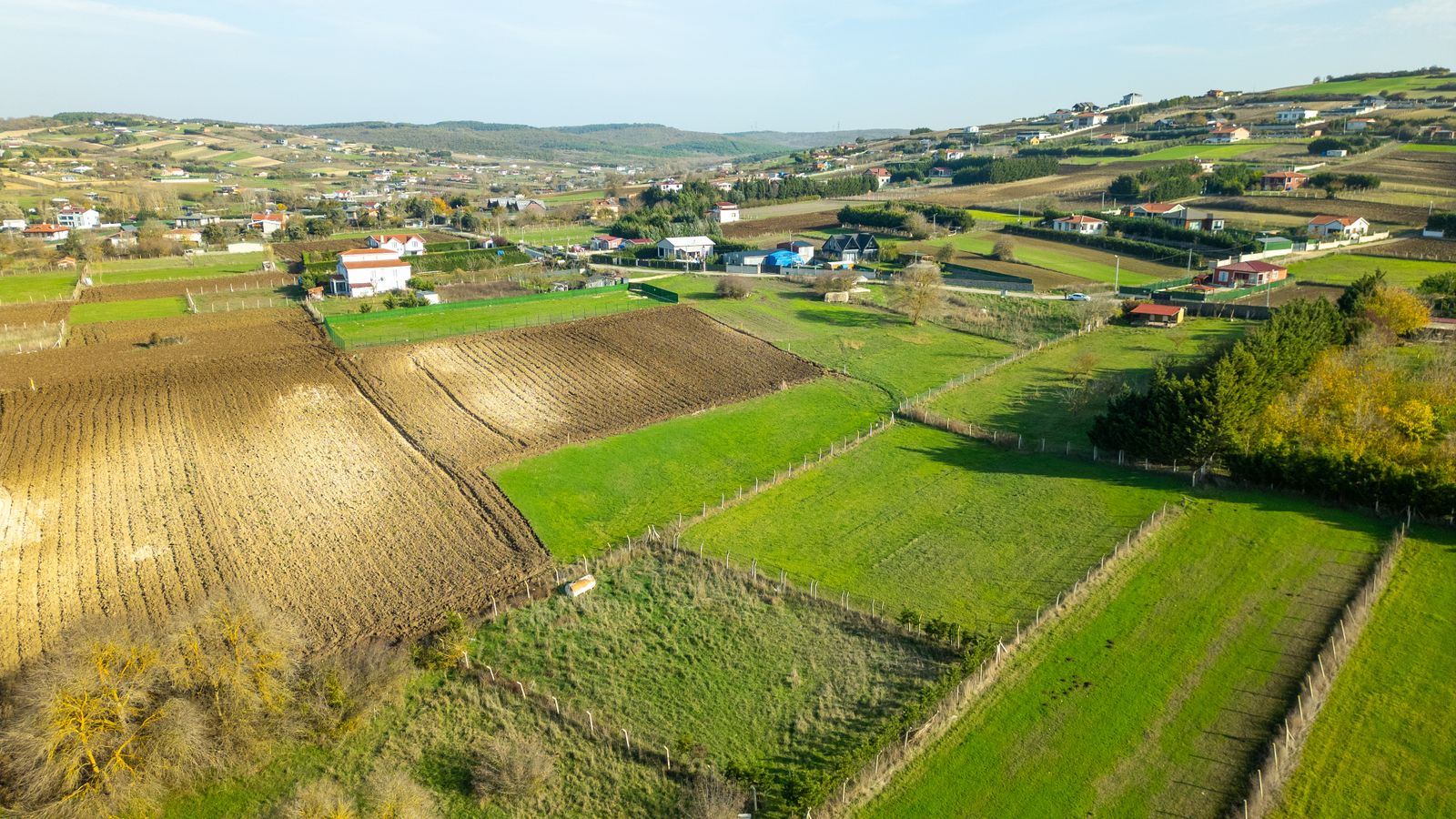 Aerial View of Houses and Croplands in the Countryside · Free Stock Photo