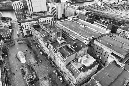 A dramatic aerial view of Glasgow city center showcasing urban architecture and streets.