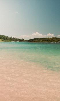 A serene tropical beach with soft sand and turquoise water, perfect for relaxation.