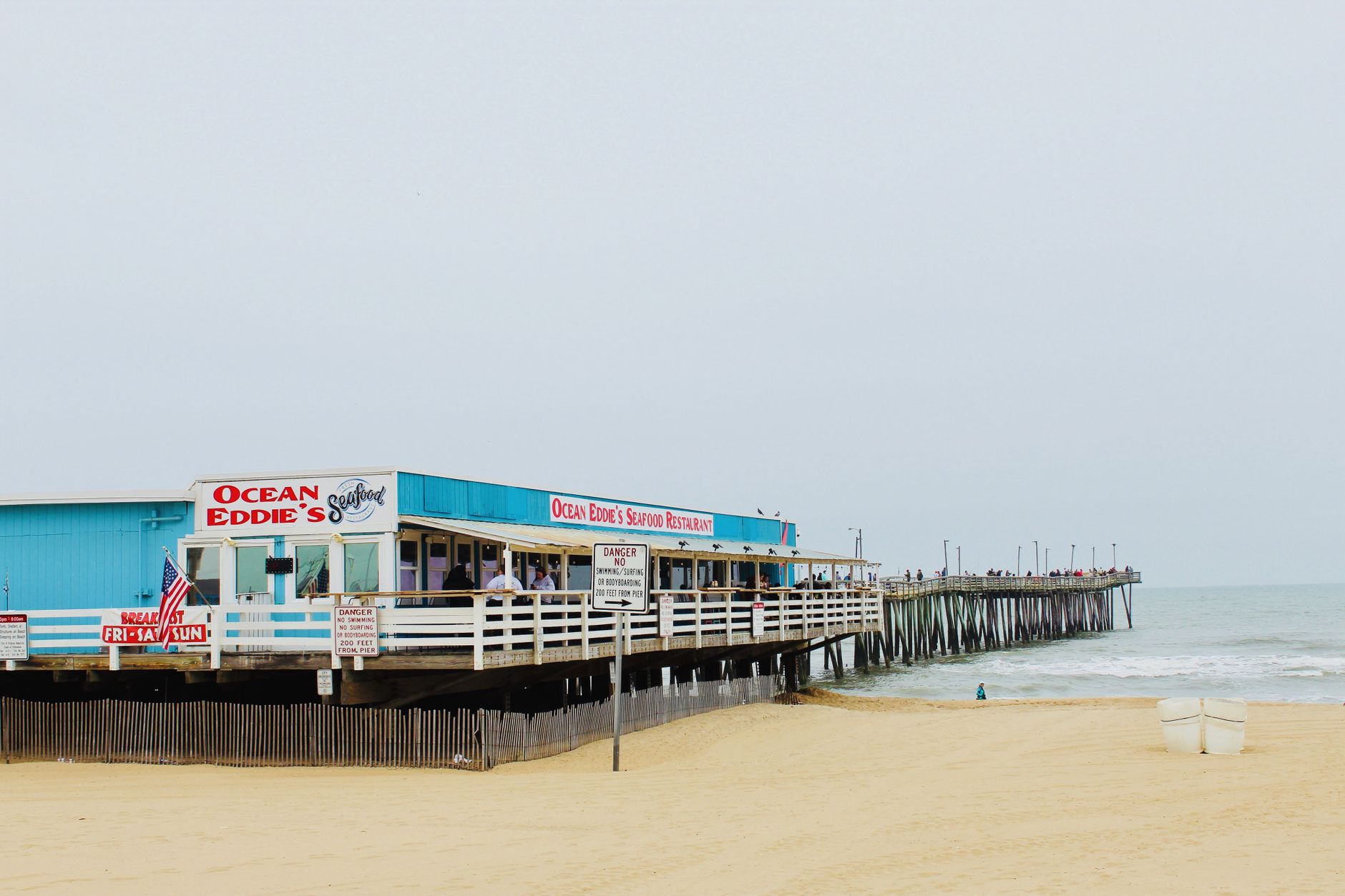 Oceanfront view of Ocean Eddie's Seafood Restaurant on a Virginia Beach pier.
