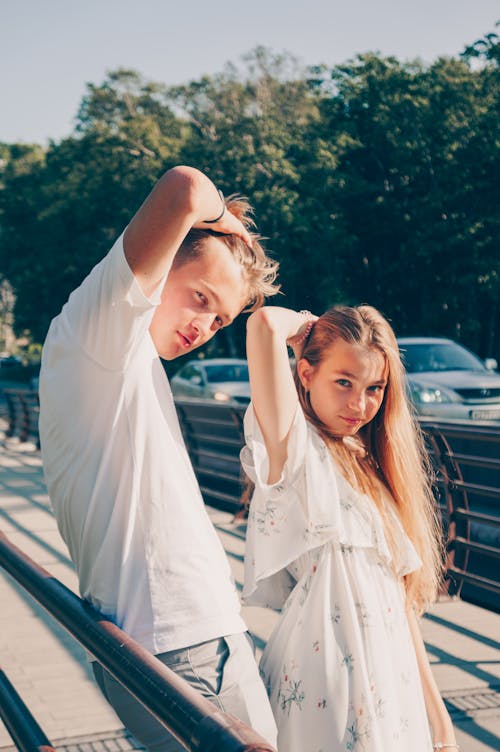 Girl and Boy Posing Near Street