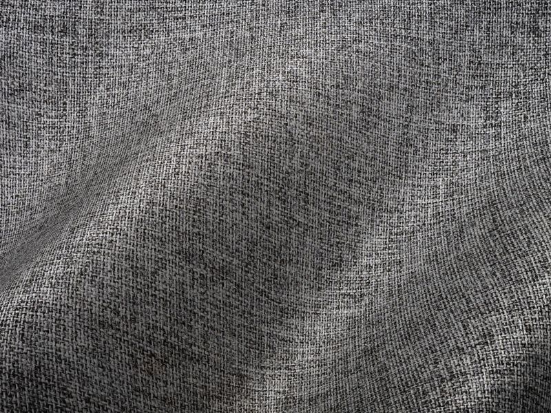 Natural linen upholstery and woven textiles selected for a Miami interior