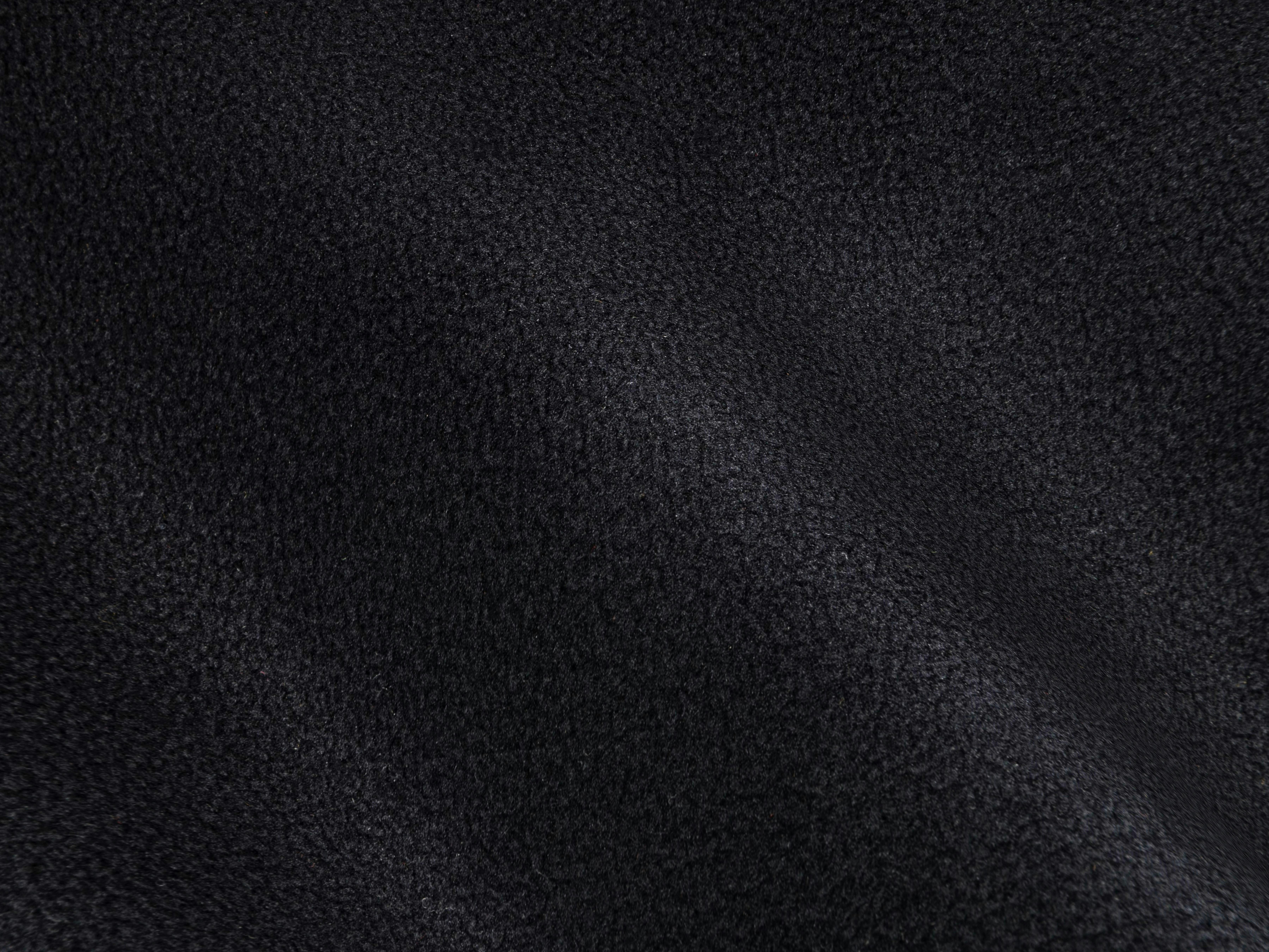 Free Detailed view of black textile fabric showing soft waves and texture. Stock Photo