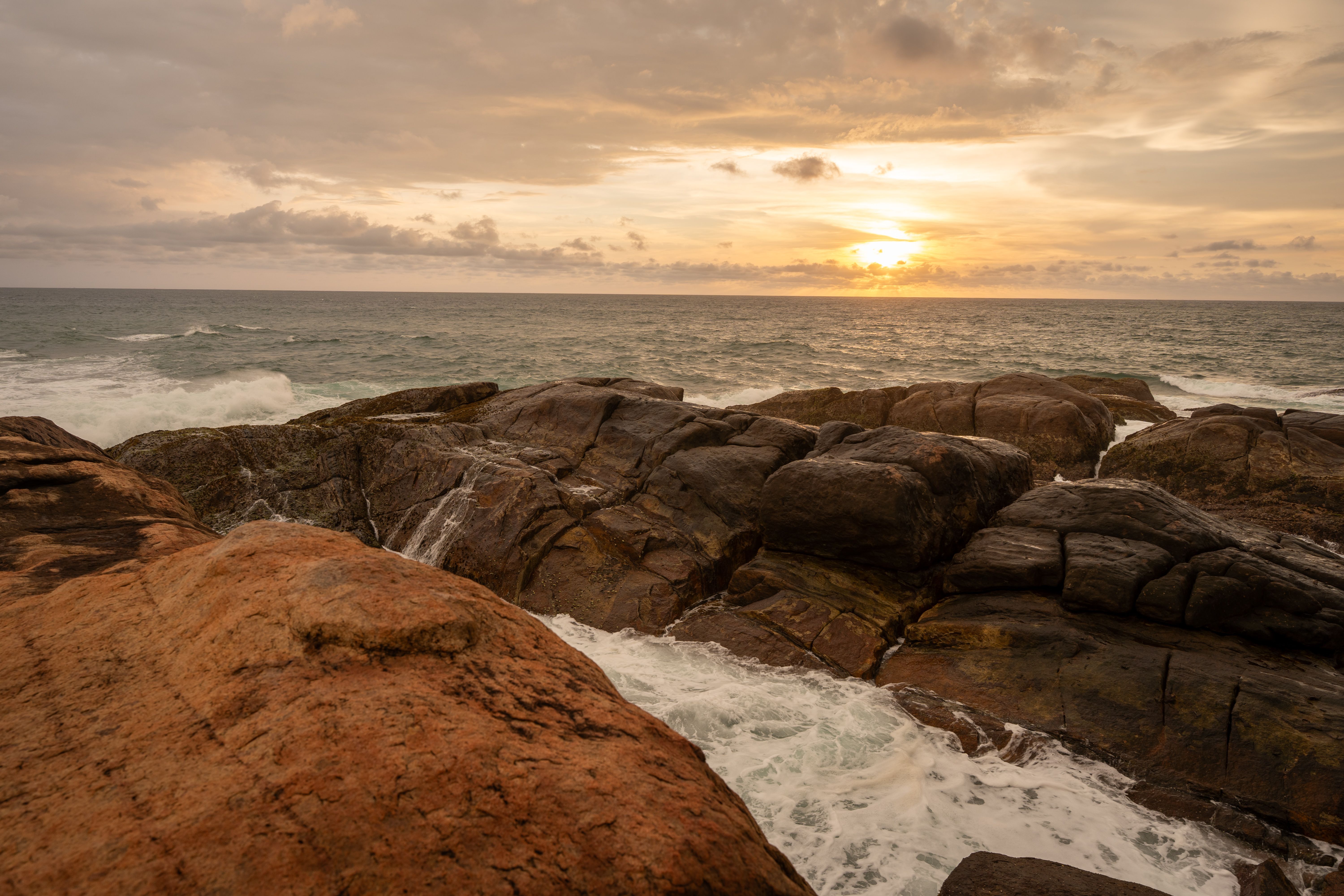 Sunset Over Rocky Beach Seascape · Free Stock Photo