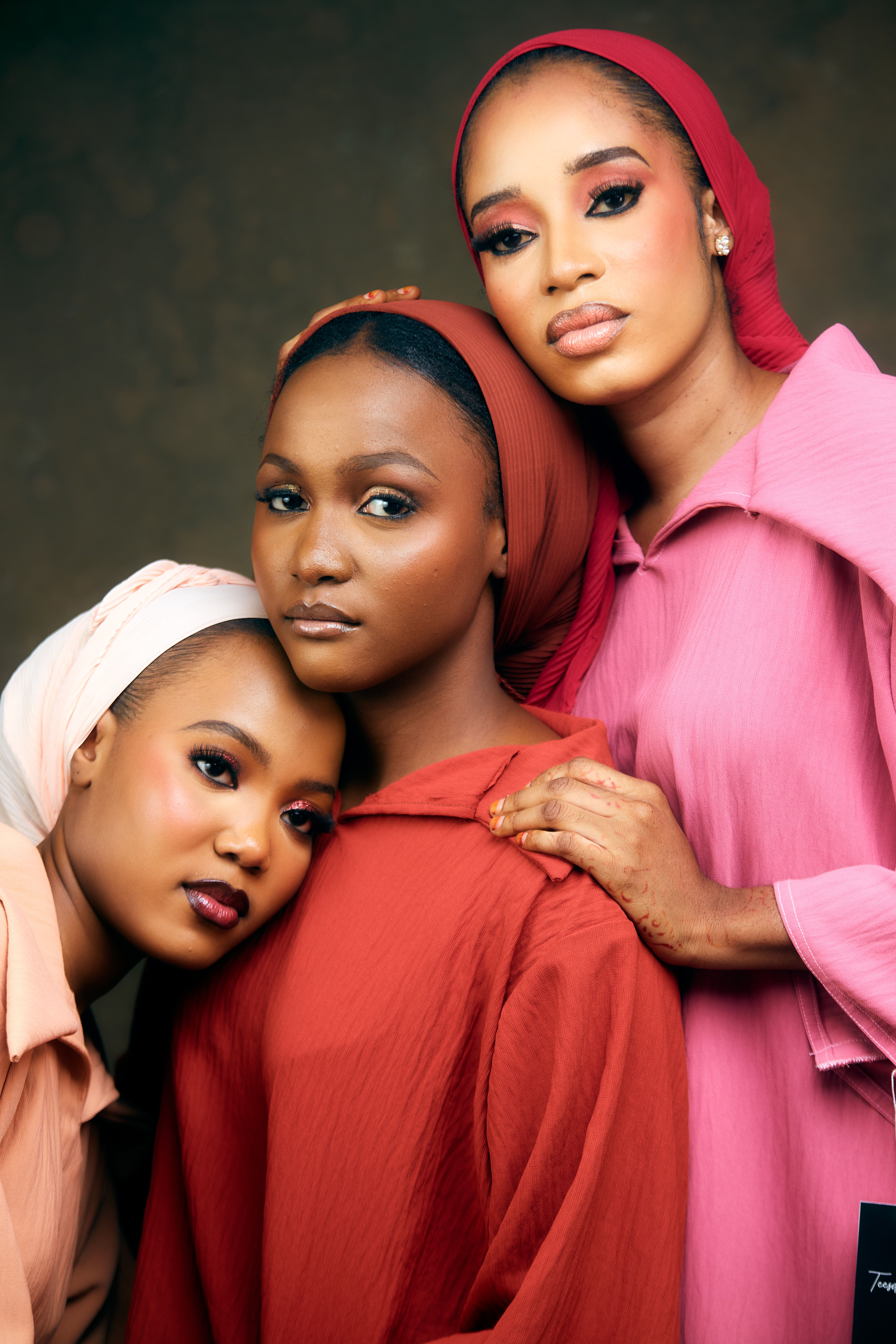 Beautiful portrait of three women wearing colorful hijabs with a confident pose.