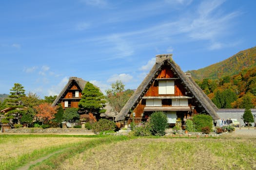 Picturesque autumn scene of Gassho-Zukuri houses in Shirakawa, Gifu, Japan, showcasing traditional Japanese architecture.