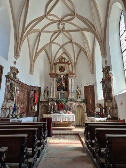 Free Stunning Gothic Revival church interior featuring ornate altar and vaulted ceiling. Stock Photo
