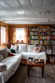 Inviting living room featuring a large bookshelf and comfortable seating in Zittau, Germany.