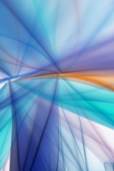 Dynamic abstract image showcasing vibrant light streaks with blue and orange hues.