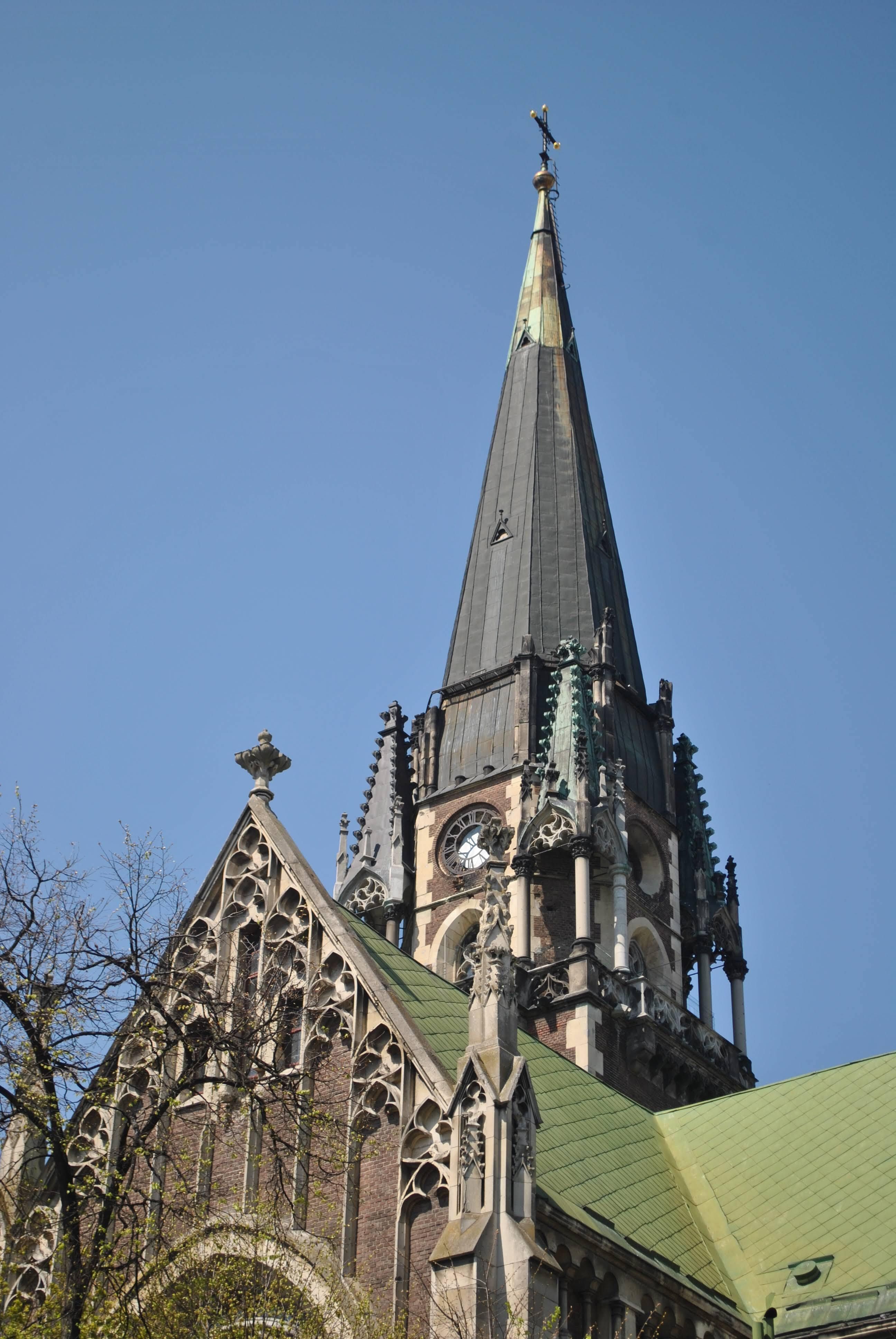 Gothic Church Spire Against Blue Sky · Free Stock Photo
