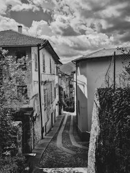 Discover this serene medieval alley captured in striking black and white.