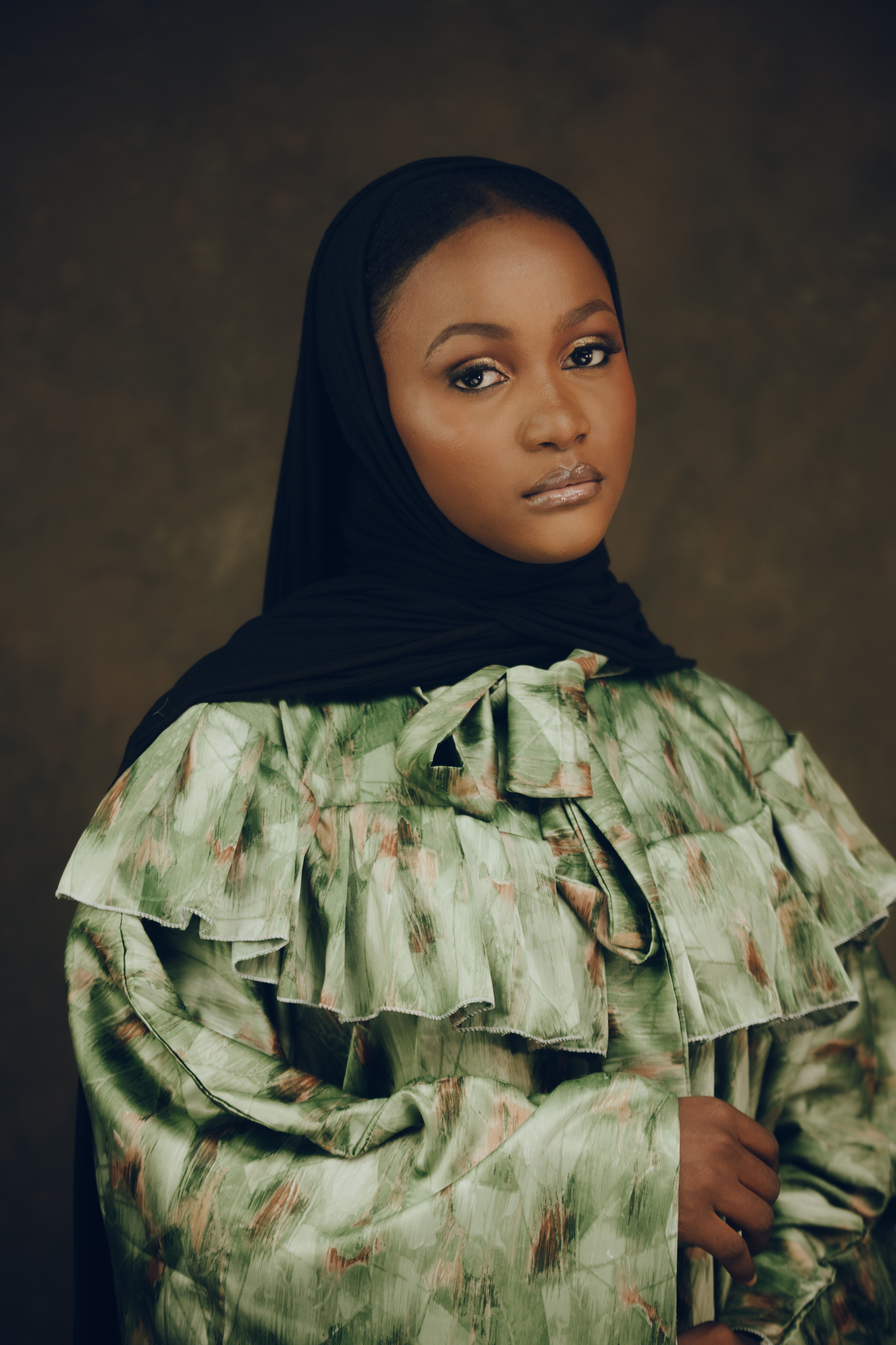 Portrait of Woman in Black Hijab and Patterned Dress · Free Stock Photo