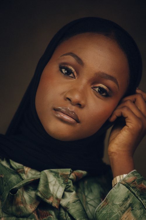 Free Close-up portrait of woman in black hijab with a serene expression. Stock Photo