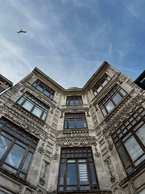 Free Stunning upward view of a historic building's facade in Istanbul with a clear sky. Stock Photo