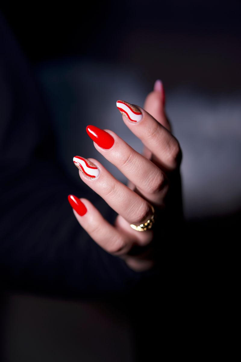 Red and white swirl nail art