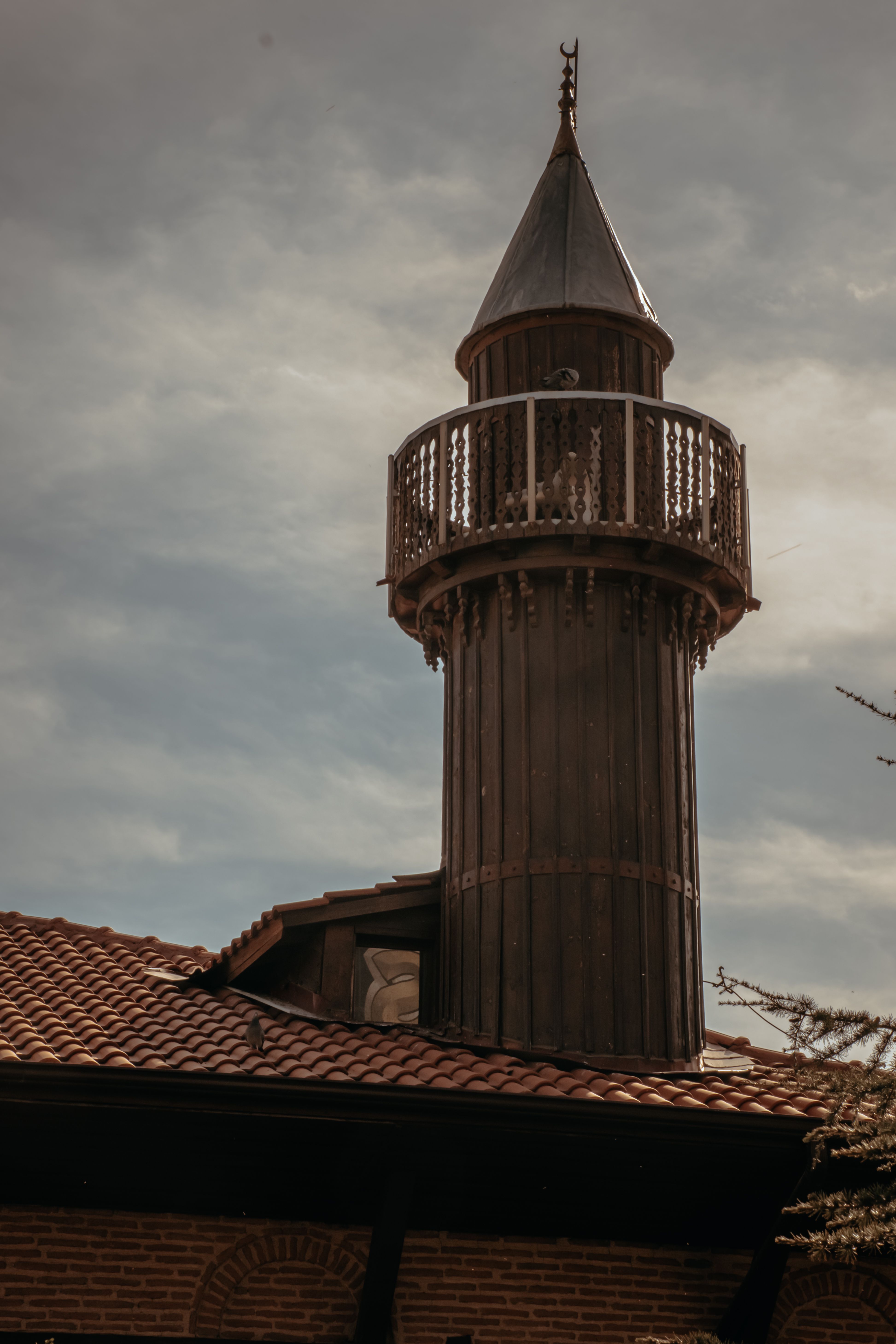 Historic Tower Against Cloudy Sky · Free Stock Photo