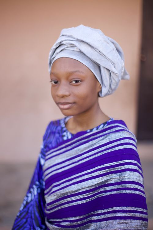 Free Beautiful portrait of a woman wearing traditional African clothing and headwrap. Stock Photo