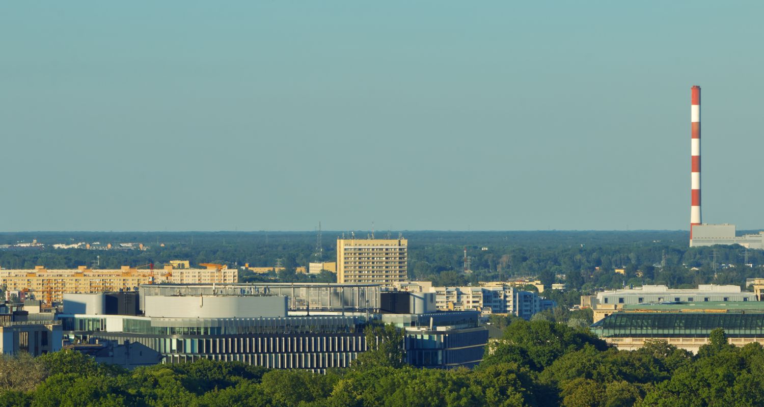 Industrial building and city skyline viewed from above
