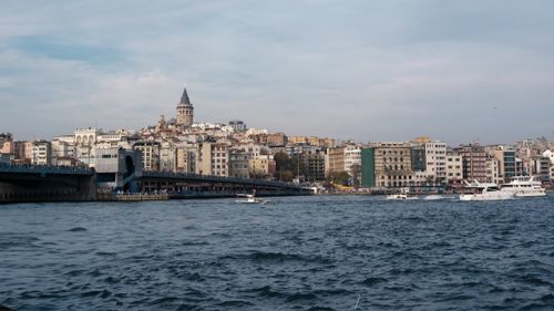 Free Explore the historic Galata Tower and vibrant cityscape of Istanbul across the Bosphorus. Stock Photo