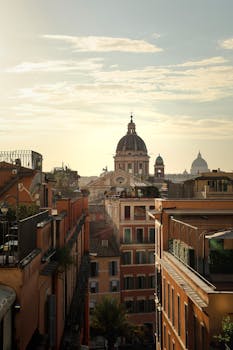 Discover the captivating view of Rome's architecture during a golden sunset, showcasing historic charm.