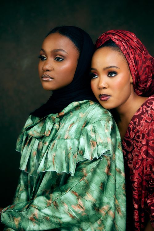 Free Two women in vibrant dresses and headscarves, embodying elegance and cultural fashion. Stock Photo