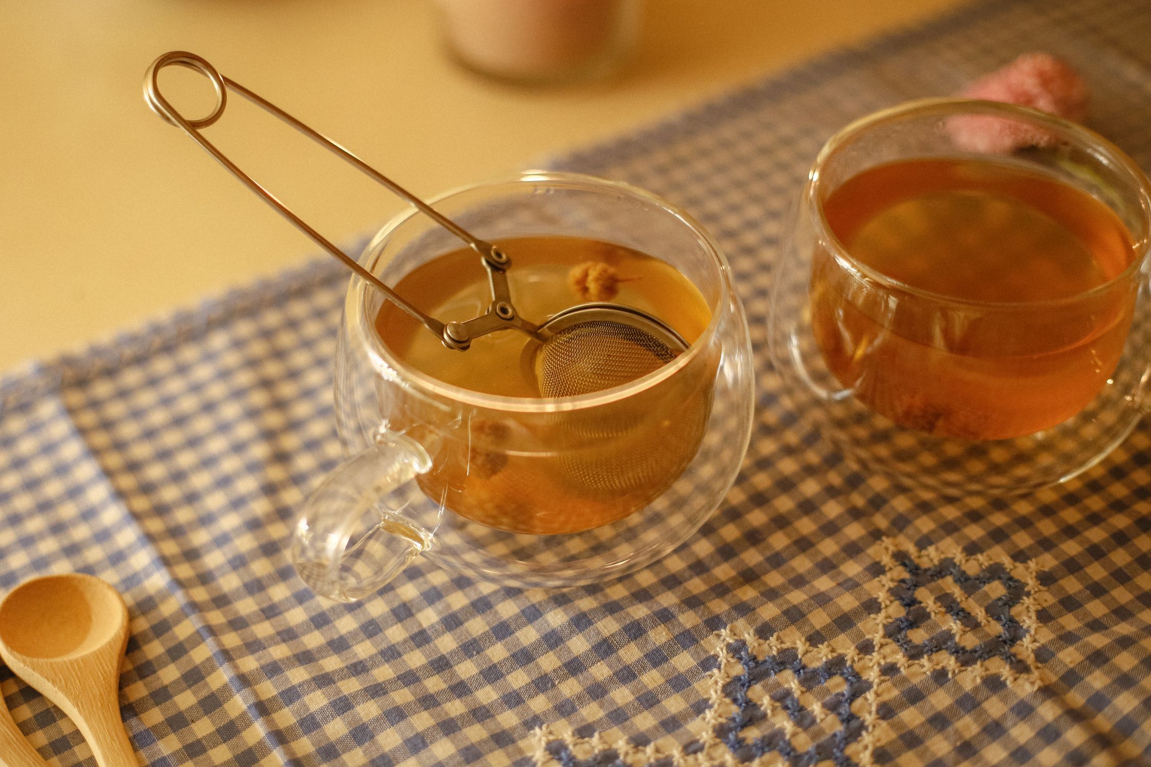 Making Tea Scenes Cozy Tea Scene with Glass Teacups and Infuser · Free Stock Photo