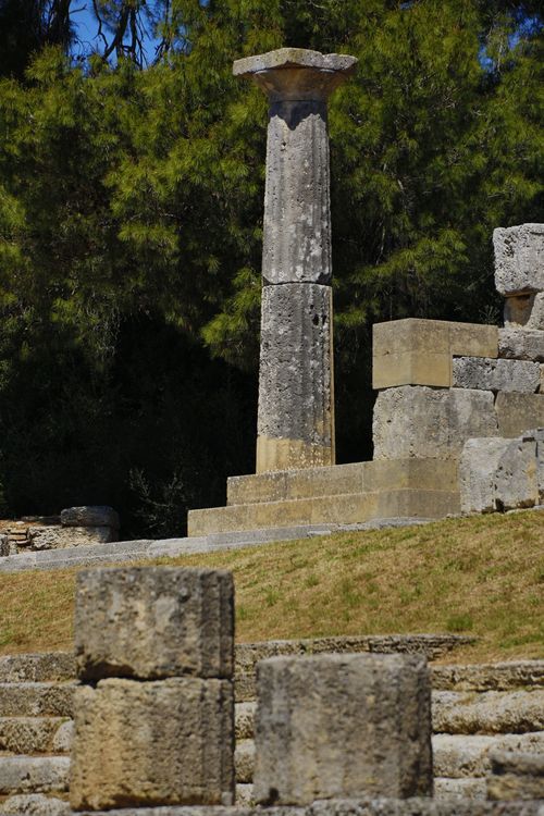Free Stone column amidst ancient Greek ruins, showcasing classical architecture. Stock Photo