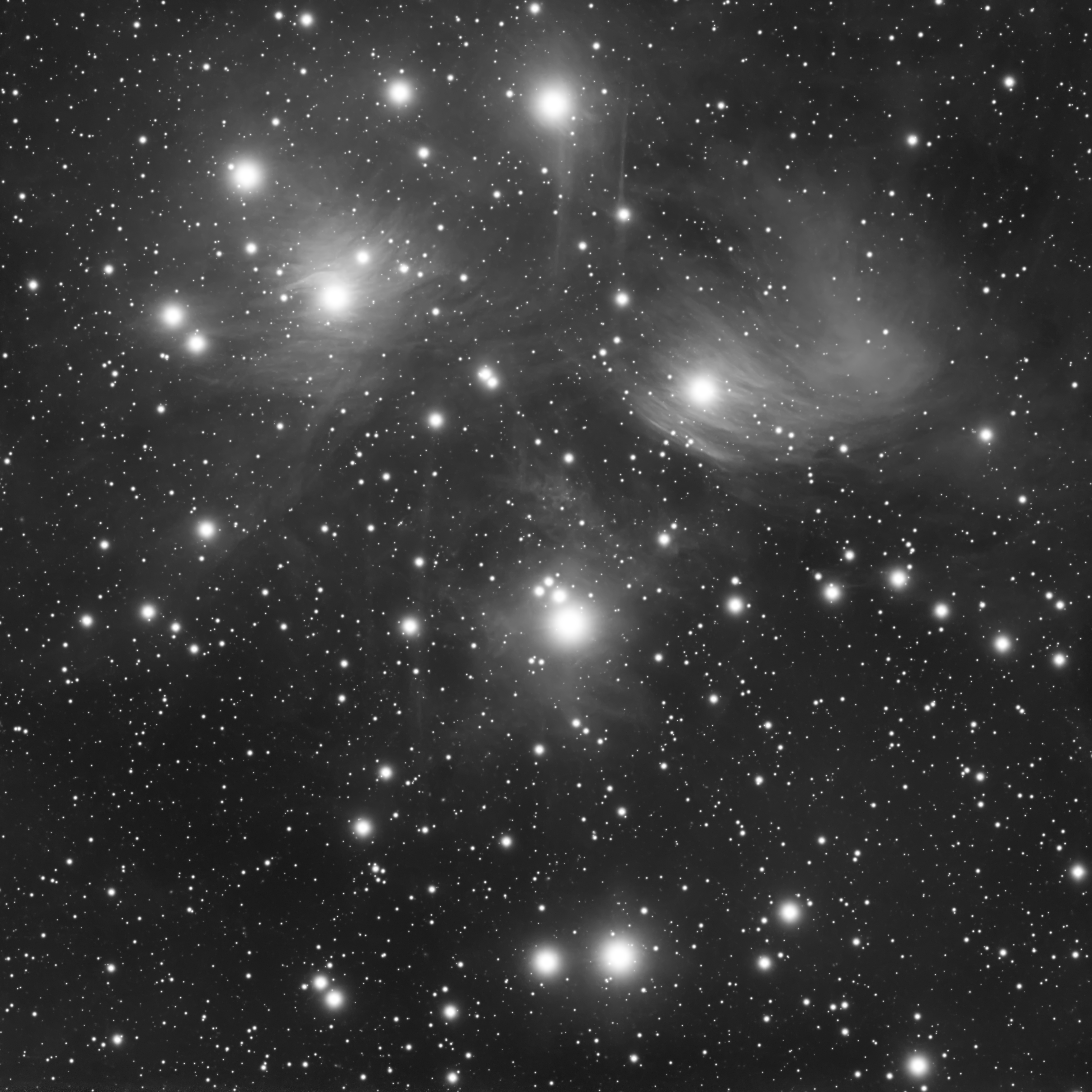 Black and white photograph of a starry night sky with visible nebulae in São Pedro de Alcântara.