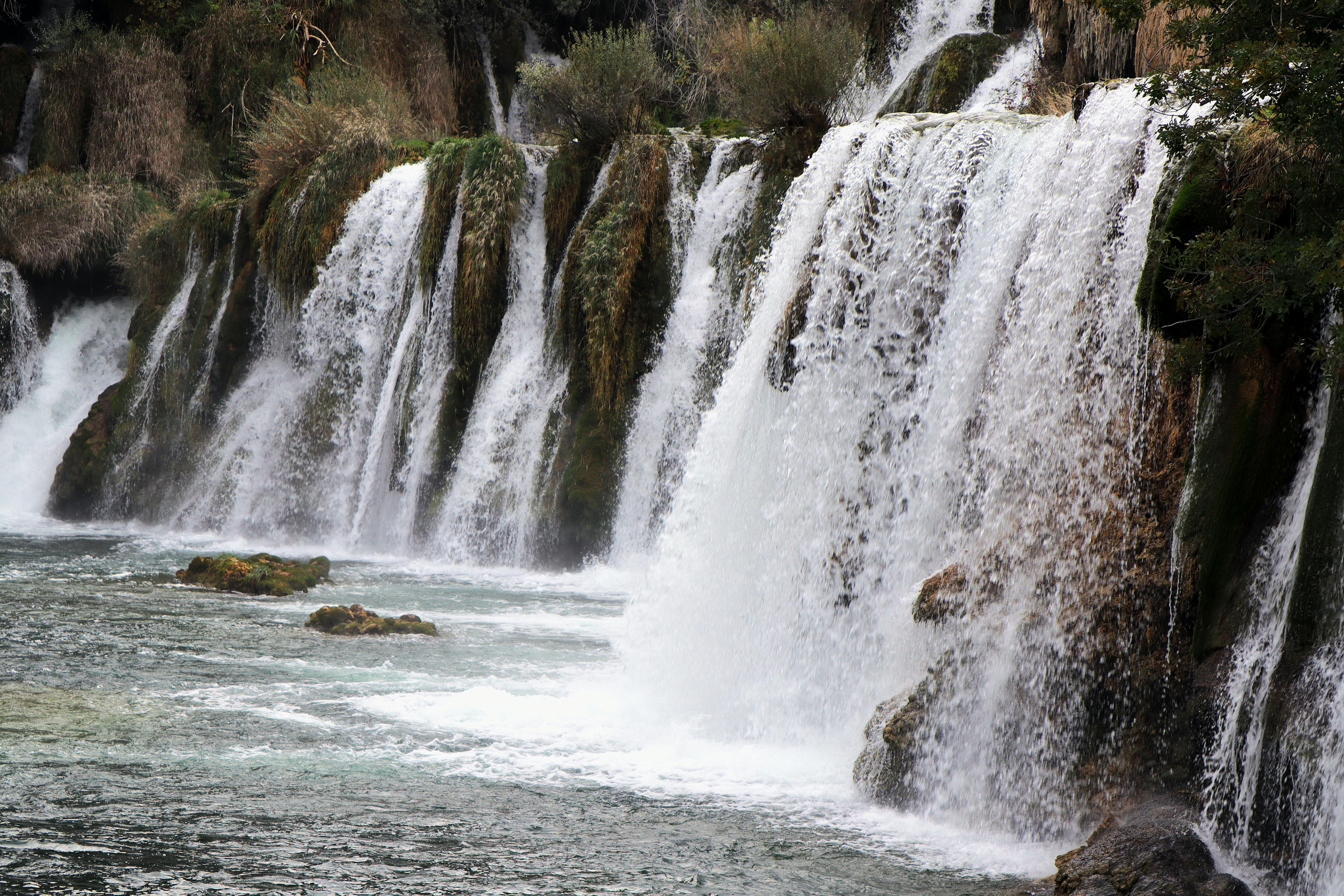 Stunning waterfalls cascading amidst lush greenery at Krka National Park in Croatia.