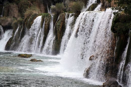 Stunning waterfalls cascading amidst lush greenery at Krka National Park in Croatia.
