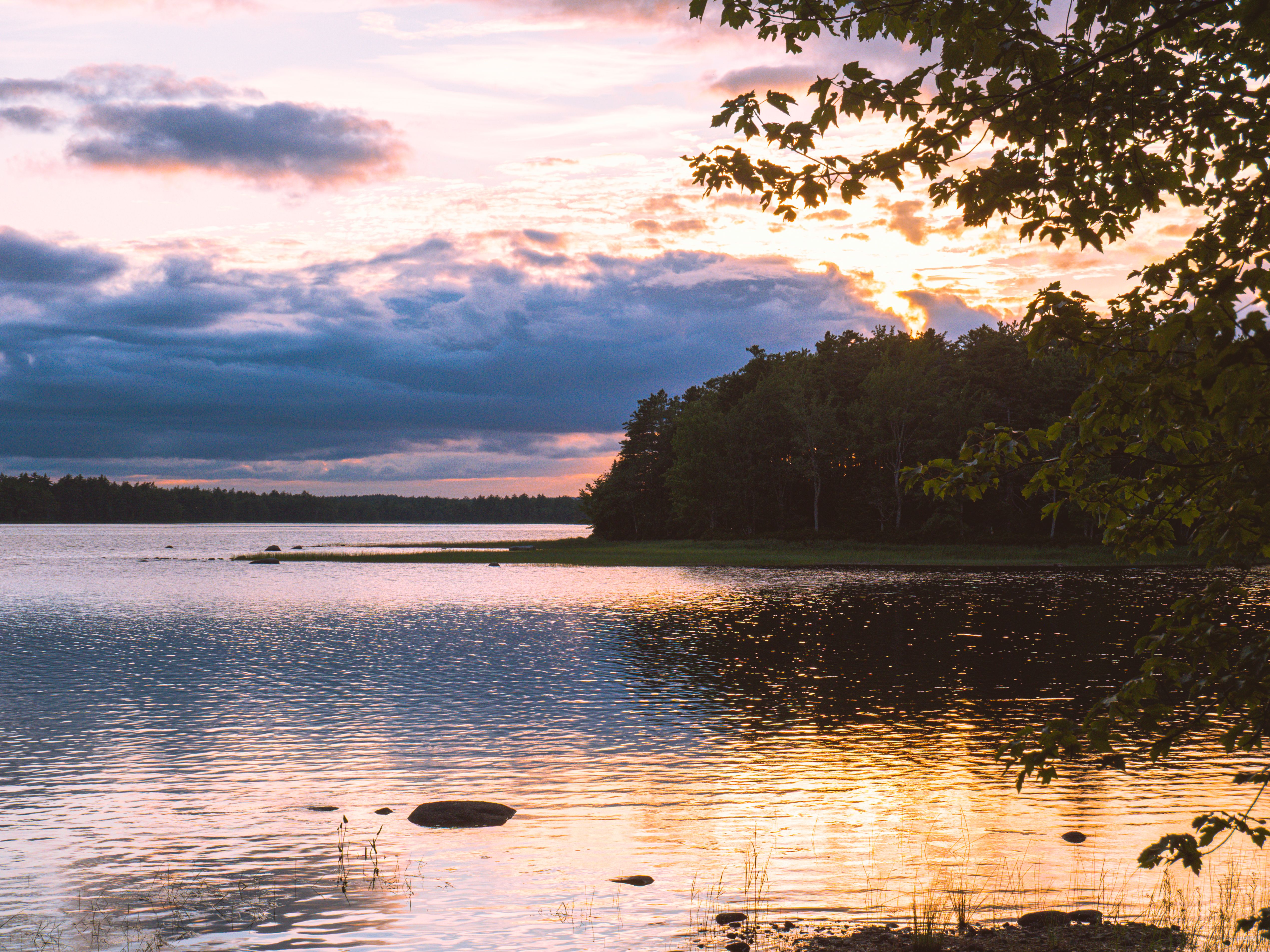 Serene Lake at Sunset with Reflective Water · Free Stock Photo
