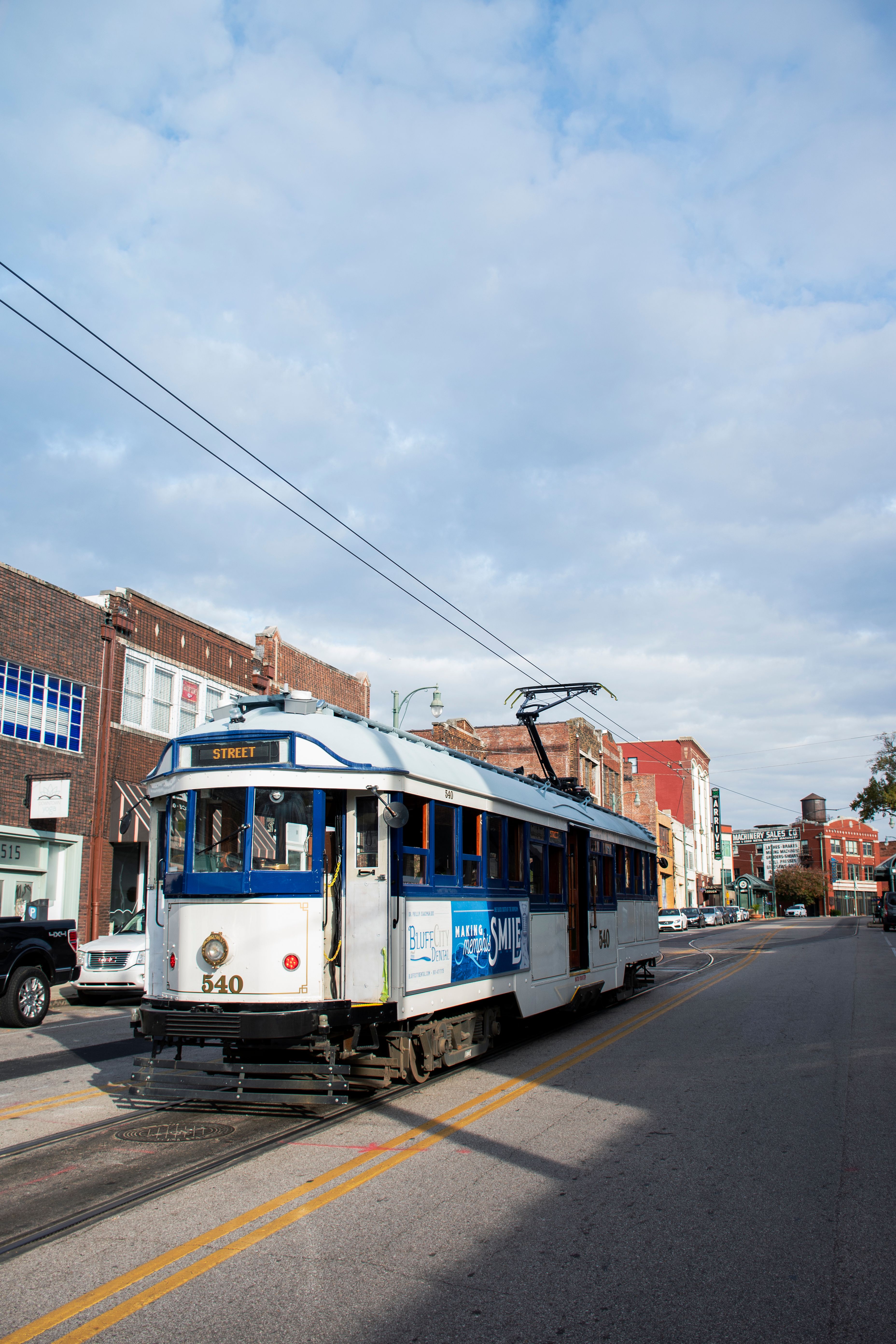 Historic Streetcar in Urban Setting on Clear Day · Free Stock Photo
