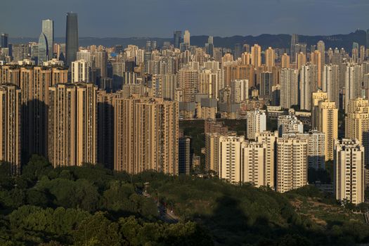 Vibrant city skyline with towering skyscrapers, capturing modern architecture at sunset.