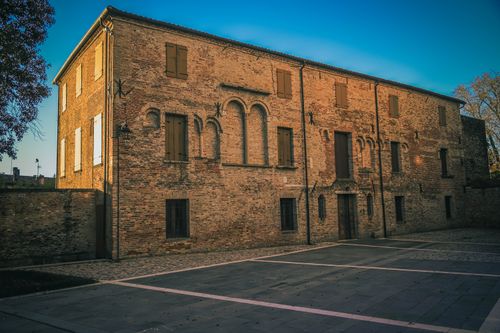 Free A charming historic brick building under a vivid blue evening sky. Stock Photo