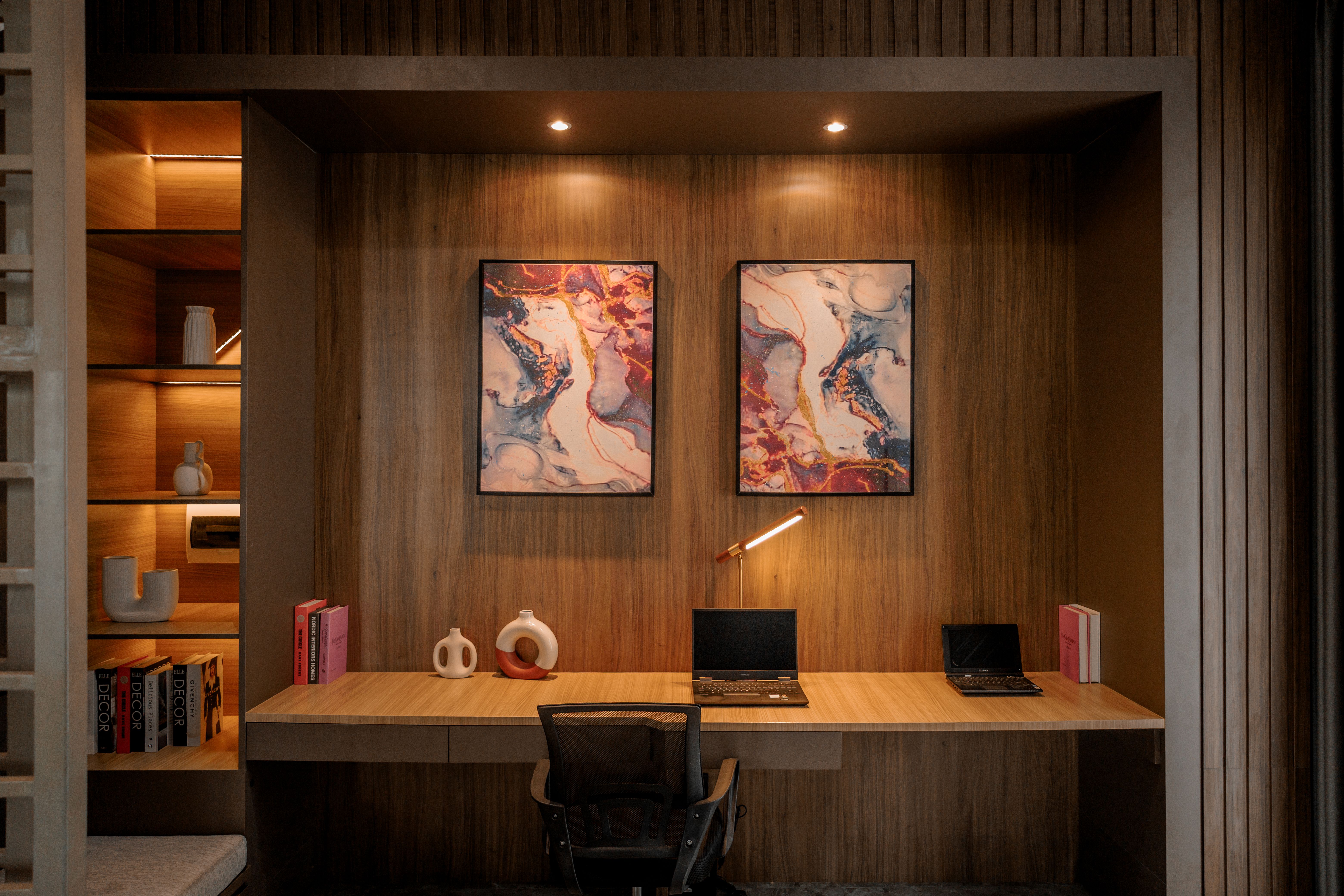 Stylish wooden home office with artistic decor and minimalistic furniture in Jakarta.