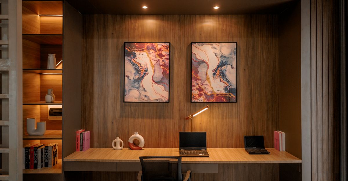 Stylish wooden home office with artistic decor and minimalistic furniture in Jakarta.