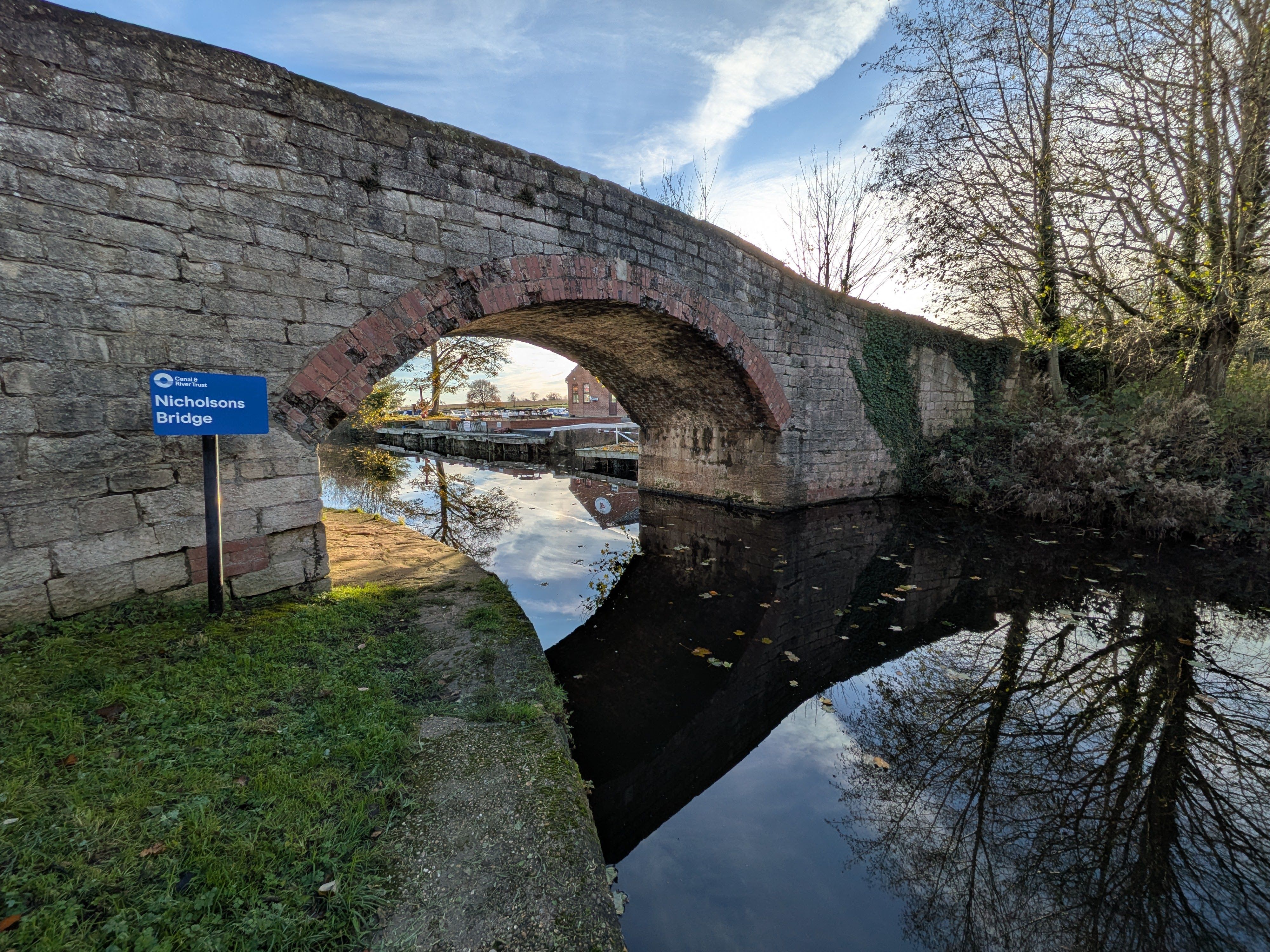 Nicholson's Bridge over the scenic Ripon Canal in England, reflecting the serene beauty of autumn outdoors.