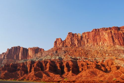 Free Red rock formations under a clear blue sky depicting vibrant desert scenery. Stock Photo