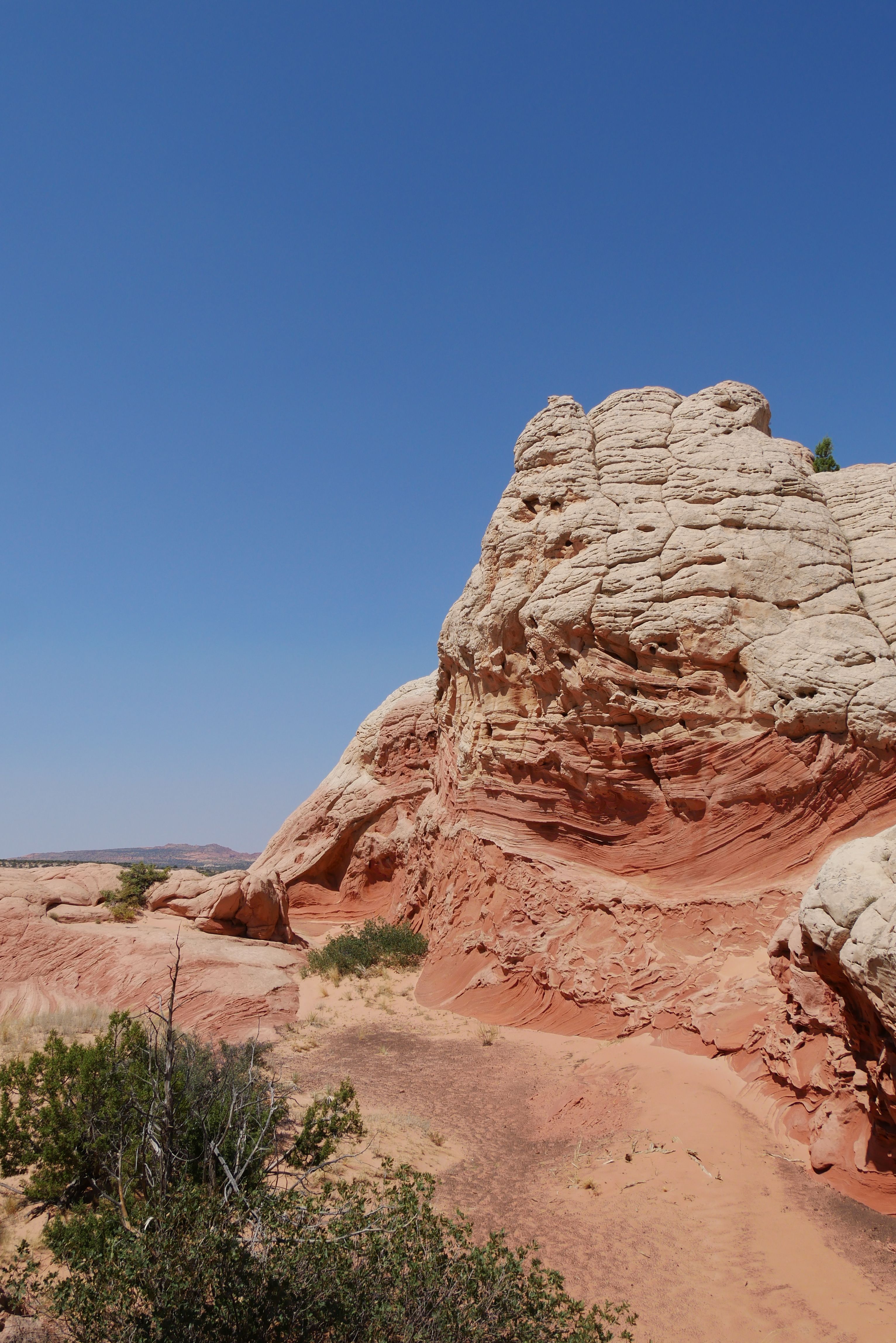 Red and White Rock Formation under Clear Blue Sky · Free Stock Photo