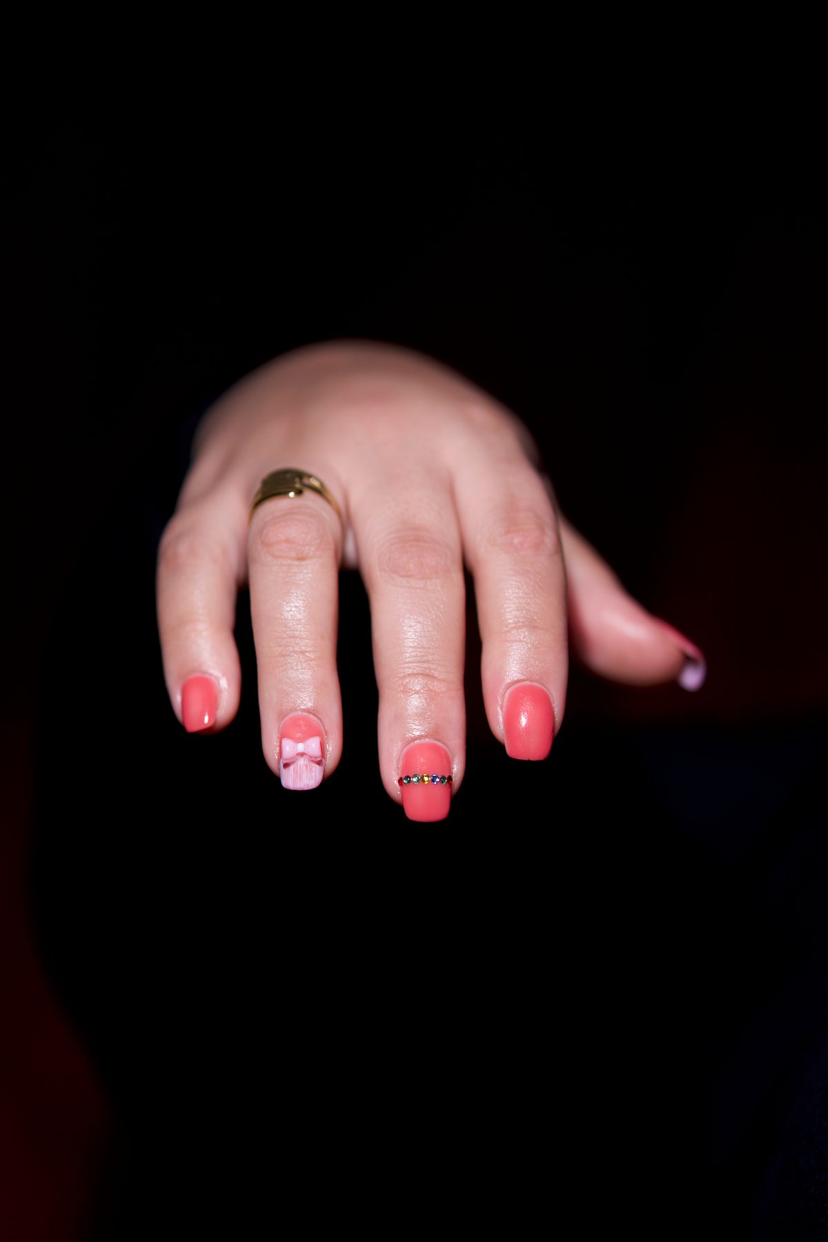Coral nail art with 3D bow detail