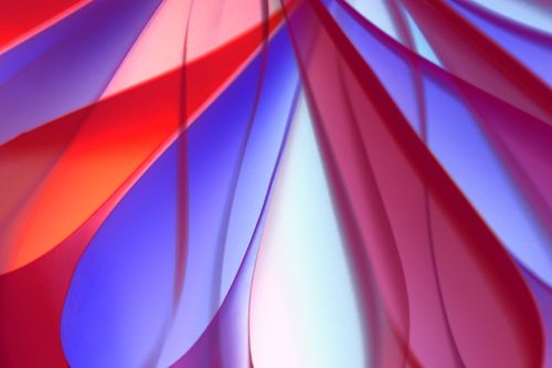 Free Vibrant abstract design with flowing red and blue fabric textures. Stock Photo