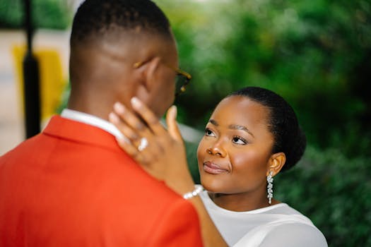 An intimate portrait of an African couple during their outdoor wedding ceremony, capturing love and elegance.