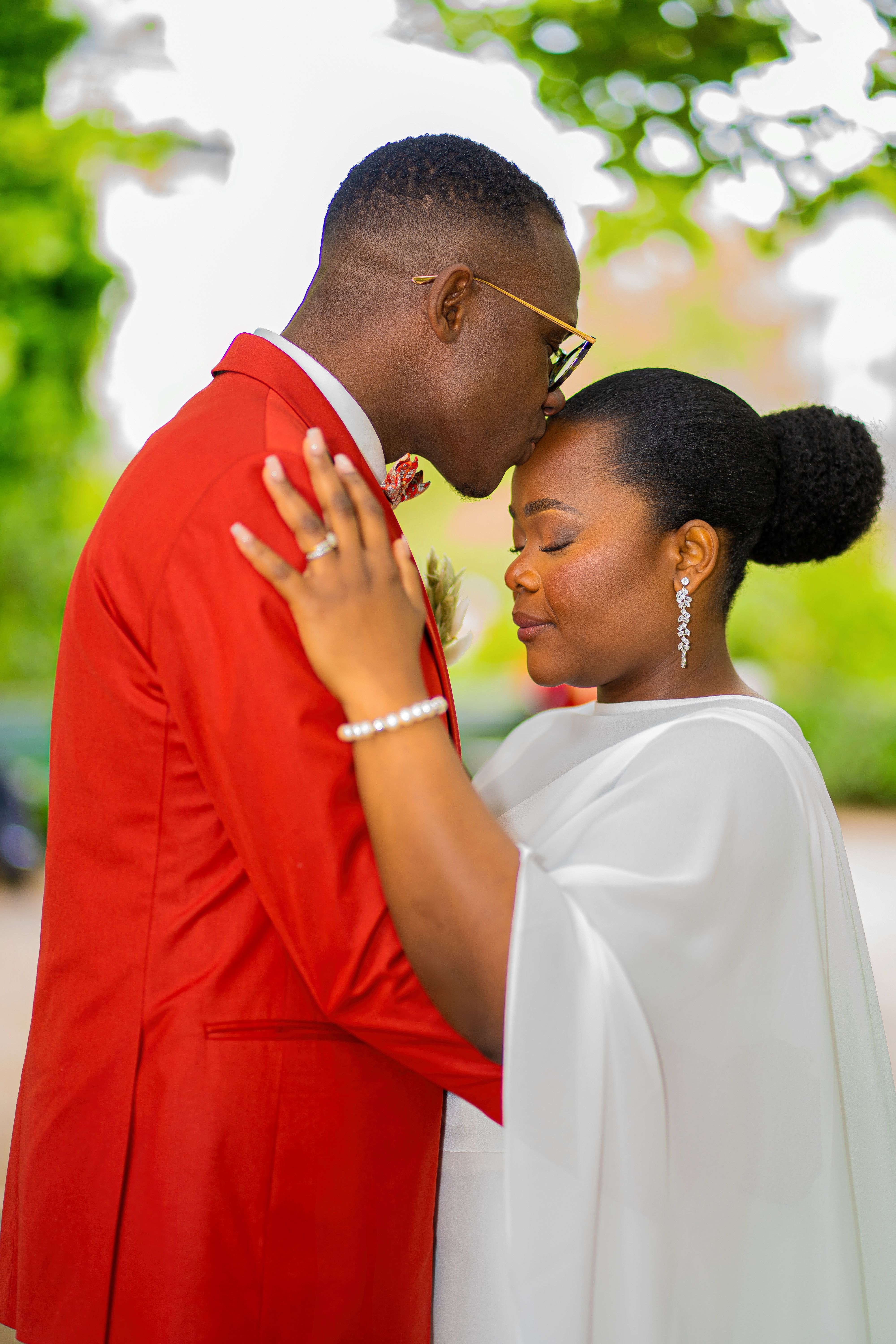 Romantic African Wedding Couple Embrace Outdoors · Free Stock Photo