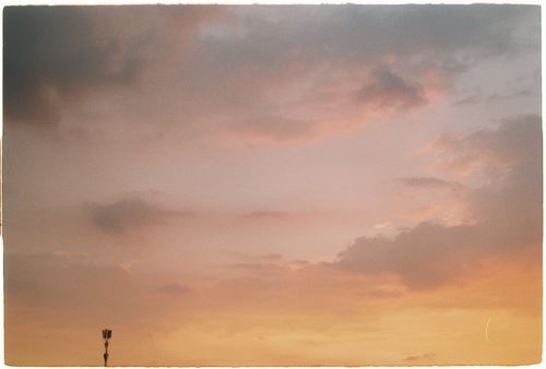 Free A tranquil sunset over Ho Chi Minh City with vibrant orange and pink clouds. Stock Photo