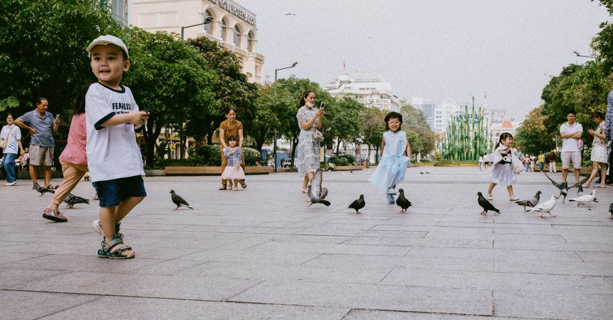 Family walking through a park in a safe European city