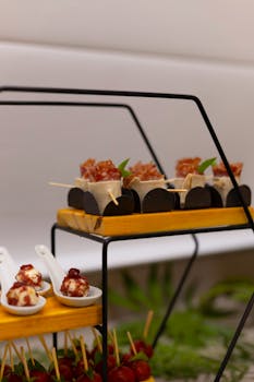 A sophisticated arrangement of gourmet appetizers and canapés at a caterered event.