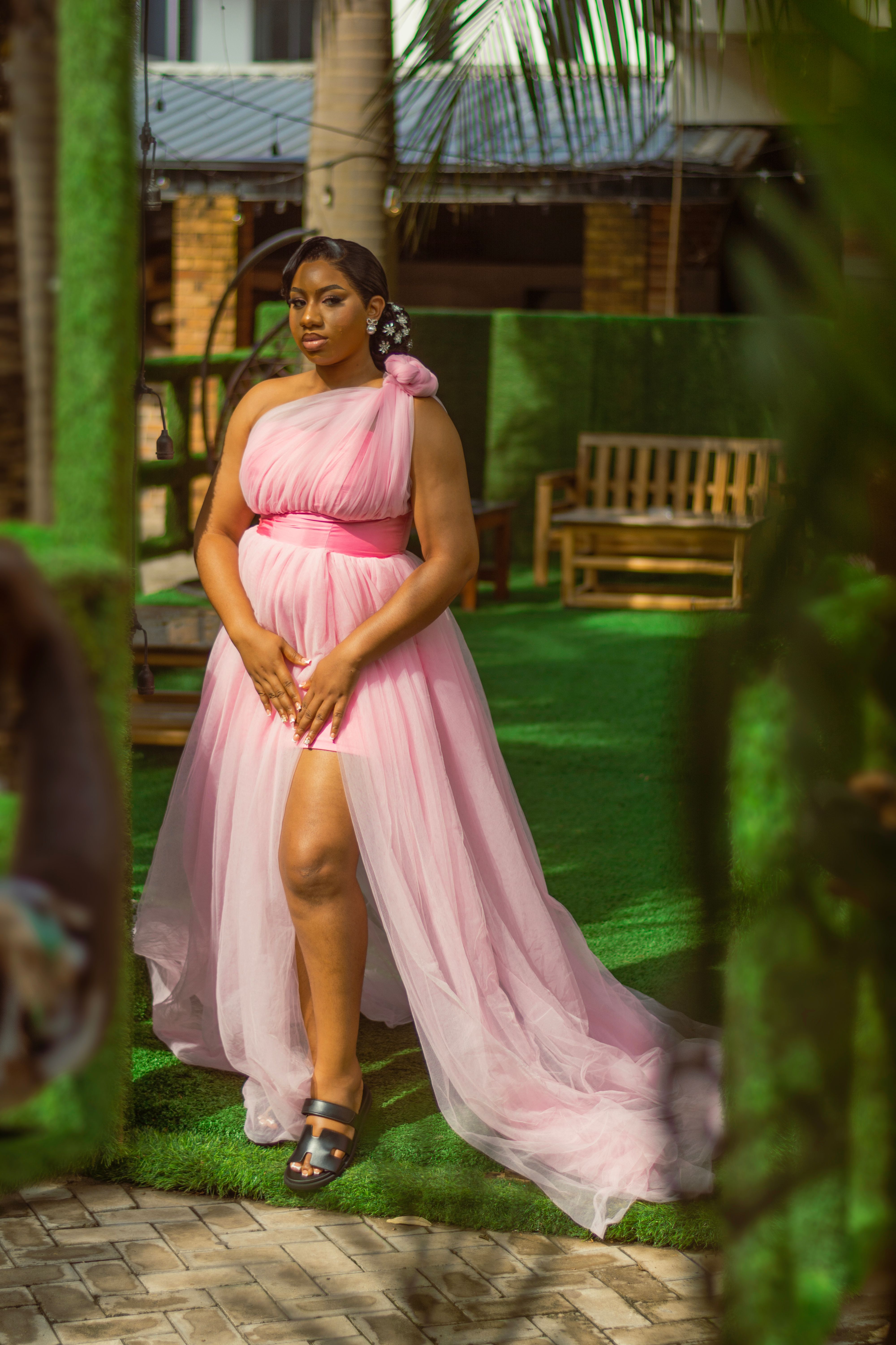 Elegant woman in a flowy pink dress outdoors · Free Stock Photo