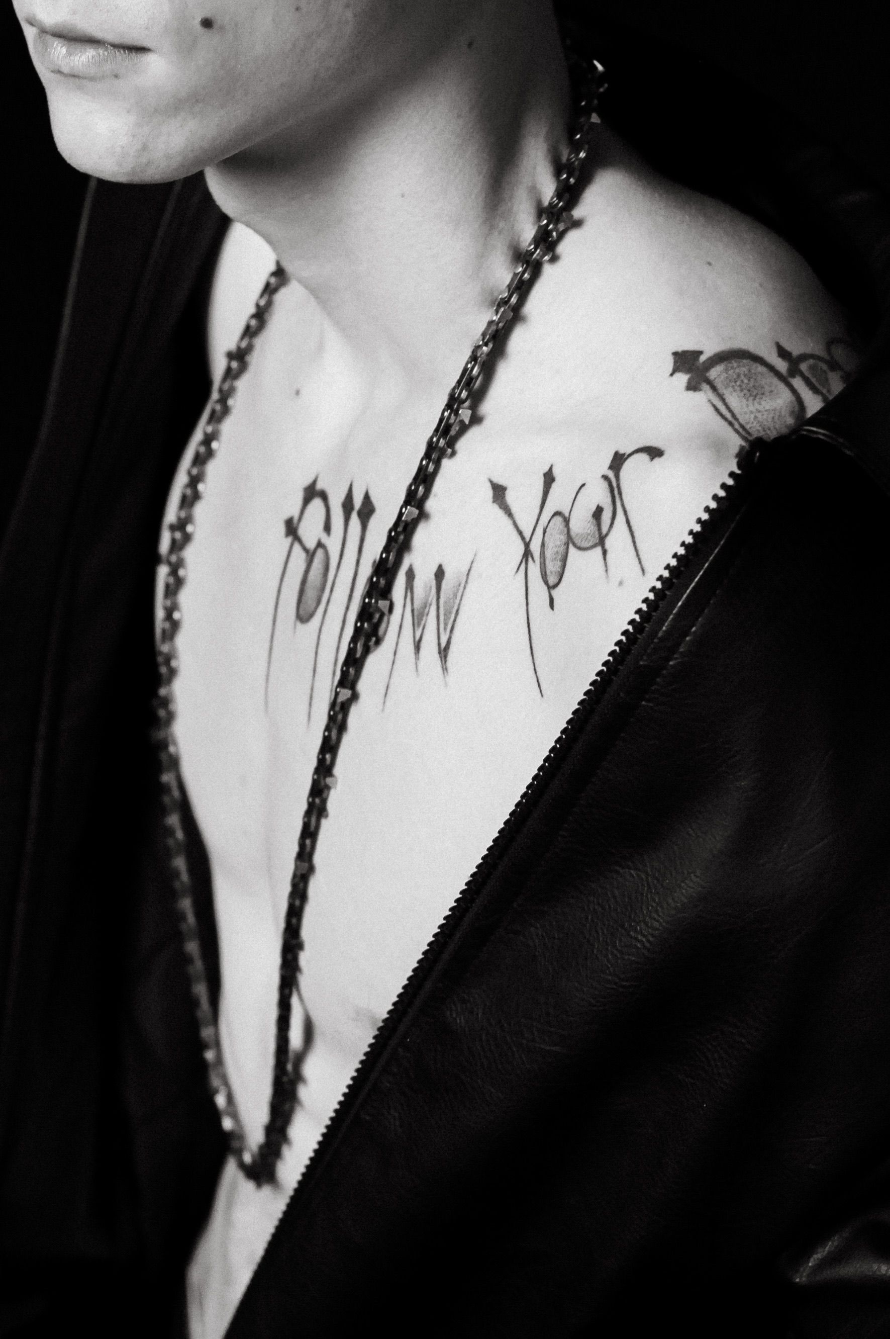 Black and White Close-Up of Tattooed Upper Body · Free Stock Photo