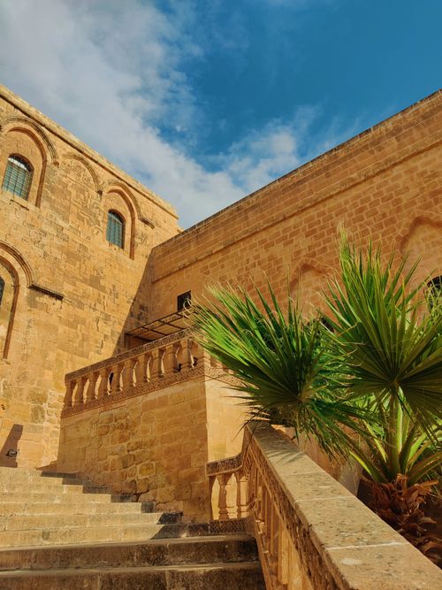 Free Explore the ancient stone architecture of Mardin, Türkiye, under a clear blue sky. Stock Photo